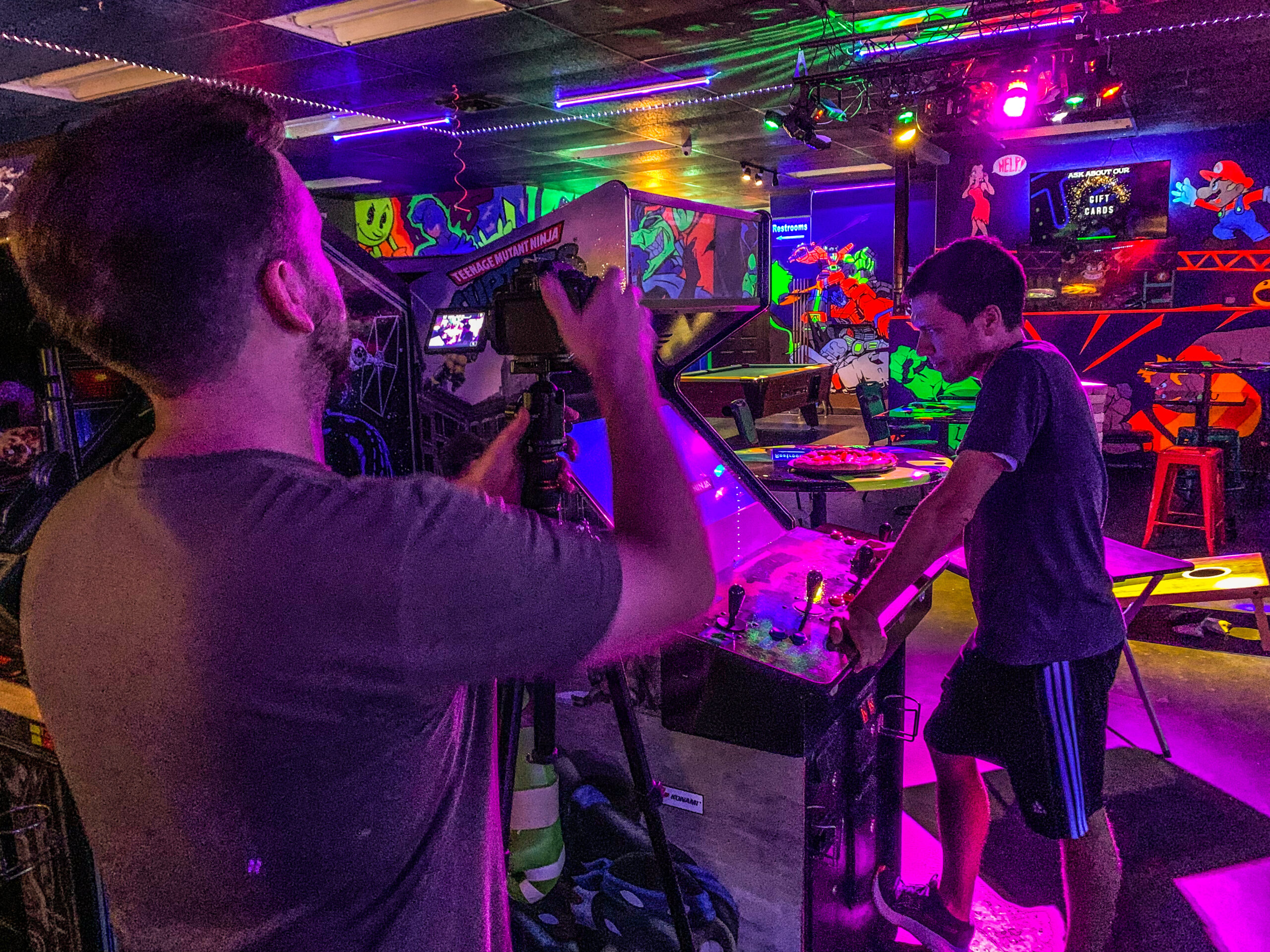 Klinton doing a videography project at an arcade.